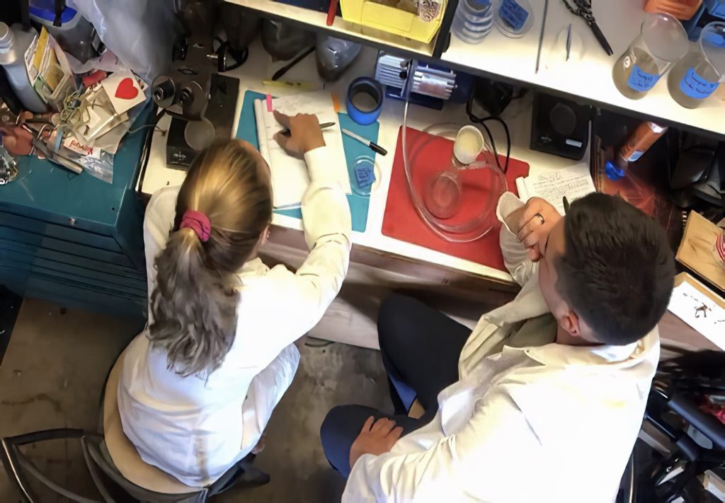Working in a garage during the pandemic, students Mia LeClerc and Eli Hill separate microfibers from sediment. Photo: Courtesy of Andrea Huvard, PhD
