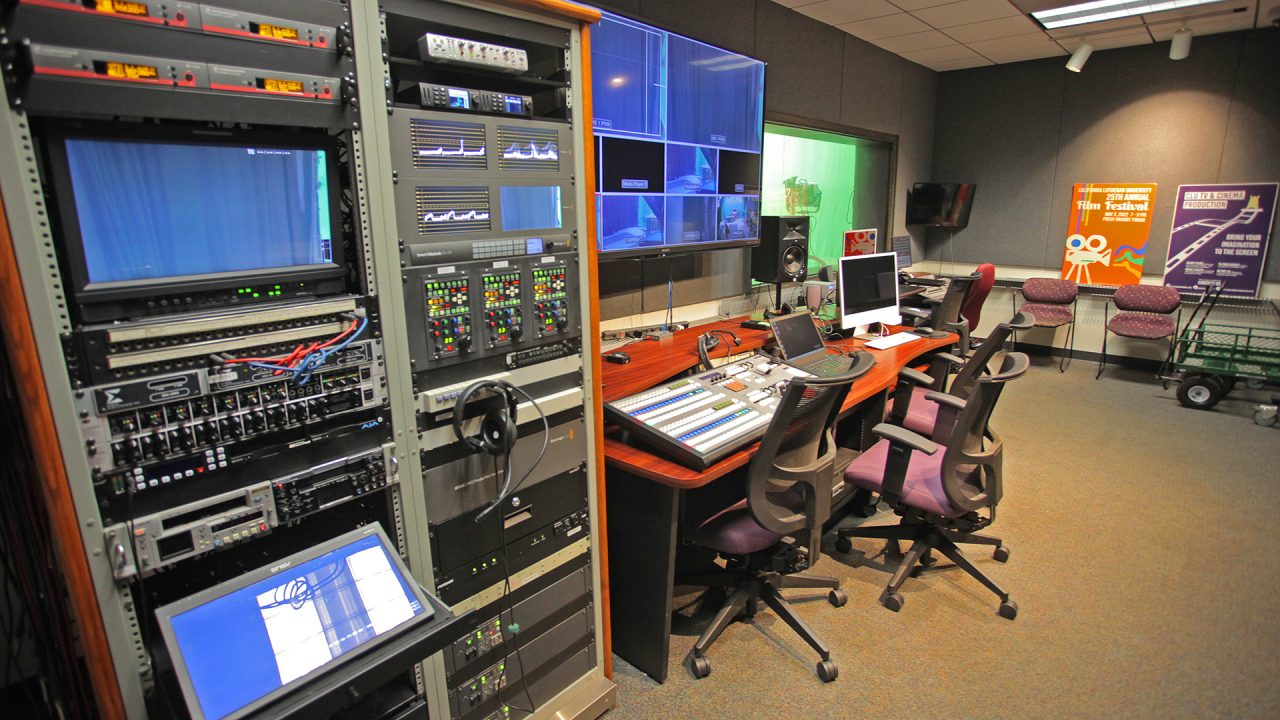 The TV studio features an HD digital production switcher with 2 ME's Broadcast graphics system, live HD streaming capability, three professional Hitachi HD broadcast cameras with Fujinon lenses, teleprompters, green screen keying, and a real news set from KTLA.