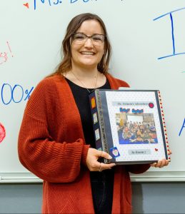 Melissa Dennin holding teacher binder